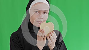 Muslim female show heart box