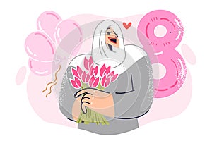 Muslim girl celebrates international women day holding bouquet of flowers in hand