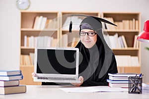 The muslim girl in hijab studying preparing for exams