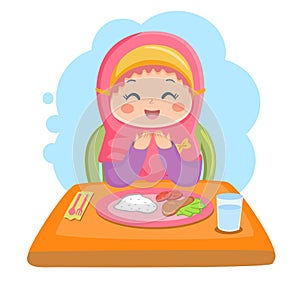 Muslim girl praying before eat