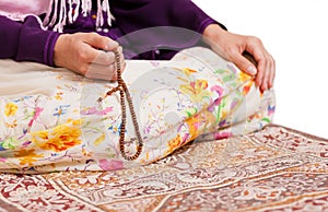 Muslim girl praying at mosque