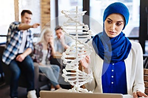 Muslim girl studying genetics