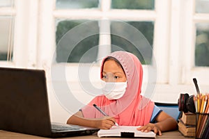Muslim girls studying online at home