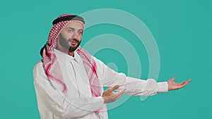 Muslim guy wearing traditional robe