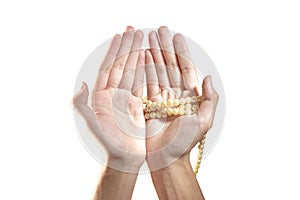 Muslim hands praying with prayer beads