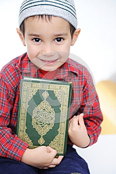 Muslim kid with holy Koran