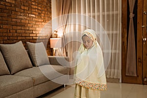 Muslim kid praying by herself