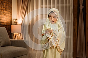 Muslim kid praying by herself