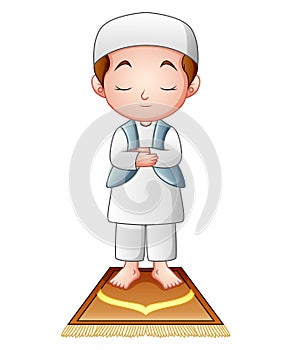 Muslim kid praying isolated on white background photo