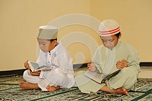 Muslim Kids Reading Koran photo