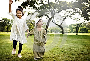 Muslim kids running in the park