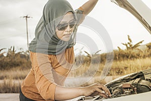 Muslim Lady Having Problem with Her Car Engine