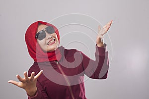 Muslim Lady in Red Shows Refusal Gesture