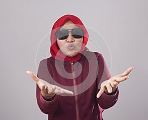 Muslim Lady in Red Shows Refusal Gesture