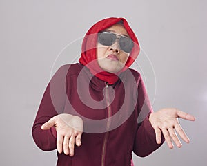 Muslim Lady in Red Shows Refusal Gesture