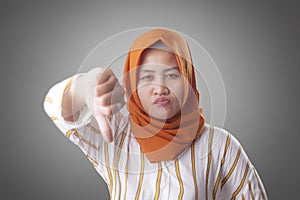 Muslim Lady Shows Thumbs Down Gesture, Disappointed Expression