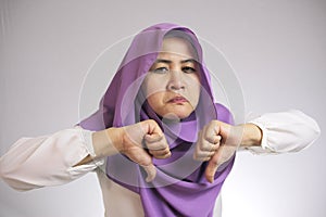 Muslim Lady Shows Thumbs Down Gesture, Disappointed Expression