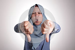 Muslim Lady Shows Thumbs Down Gesture, Disappointed Expression