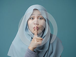 Muslim Lady Shushing Gesture photo