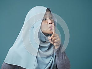 Muslim Lady Shushing Gesture photo
