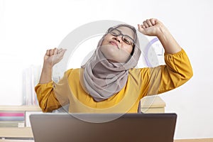 Muslim Lady Stretch Her Arms and Back at the Office