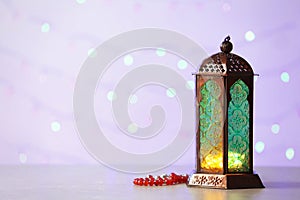 Muslim lamp Fanus with prayer beads and space for design