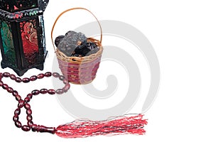 Muslim lamp, tasbih with dates on white background