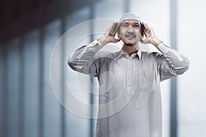 Muslim man doing adzan