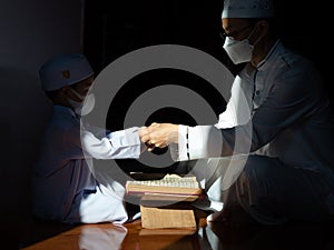 Muslim man with fully traditional white dress