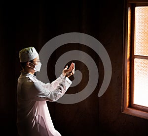 Muslim man with fully traditional white dress