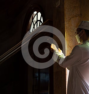 Muslim man with fully traditional white dress