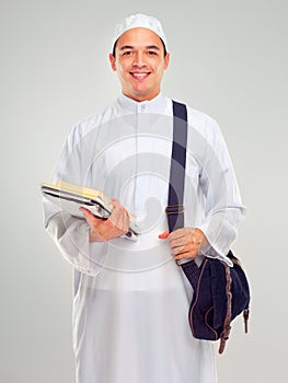 Muslim man, islamic student and standing ready for religious studying, worship or spiritual education in white
