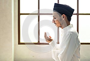 Muslim man making Dua to Allah