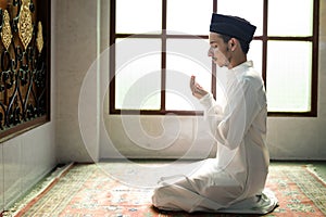 Muslim man making Dua to Allah photo