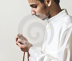 Muslim man with prayer beads photo