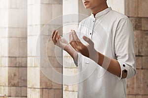 Muslim man praying inside mosque