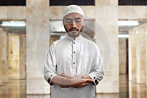 Muslim man pray inside mosque
