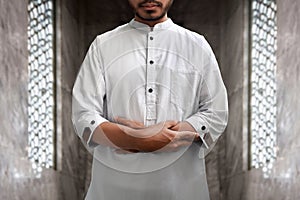 Muslim man praying in mosque