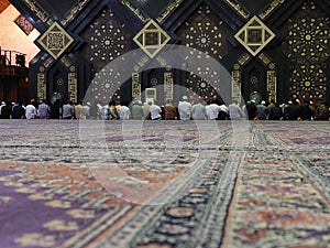 Muslim man praying in the mosque