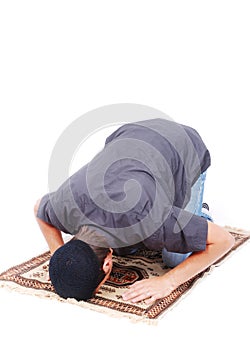 Muslim man is praying on traditional way