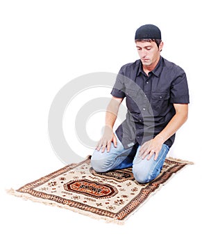 Muslim man is praying on traditional way