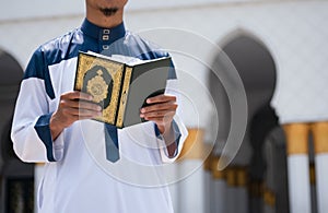 Muslim man reading holy Quran. Islamic concept