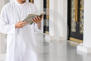 Muslim man reading holy Quran. Islamic concept