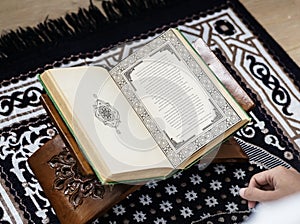 Muslim man studying The Quran