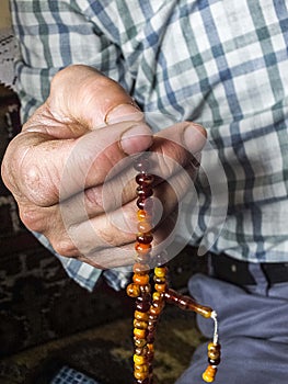 A Muslim man who attracts praise, a Muslim who worships a Muslim man pulling a rosary