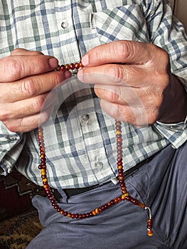 A Muslim man who attracts praise, a Muslim who worships a Muslim man pulling a rosary