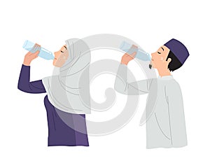 Muslim man and woman drink water from plastic bottle.