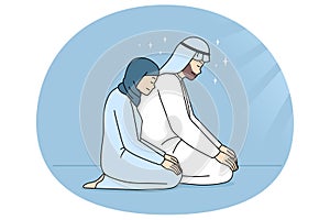 Muslim man and woman praying