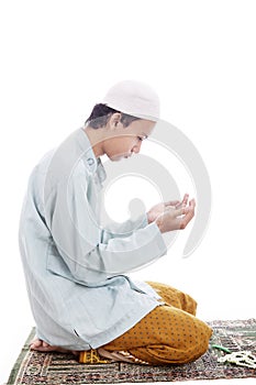 Muslim man worshiping on mat