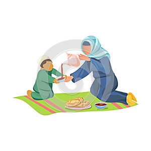 Muslim mother drink hot arabic coffee with her son